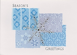 foil snowflake on patterned background